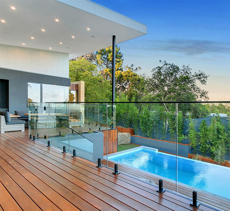 Frameless glass pool fence with stainless steel spigots, offering high durability and safety